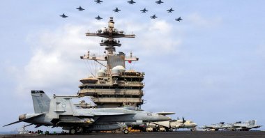 The Carrier Air Wing (CVW) 7 flying in formation over the USS George H.W. Bush (CVN 77), Arabian Sea, June 30, 2026. (AFP Photo)