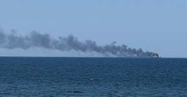 Smoke rises from a civilian vessel on fire amid Russia's attack on Ukraine, in Odesa, Ukraine, July 19, 2026. (Reuters Photo)
