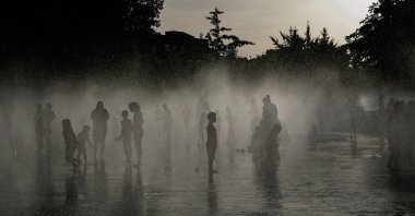 People off in a water fountain as Spain experiences a heatwave, in Madrid, Spain, June 23, 2026. (AFP Photo)