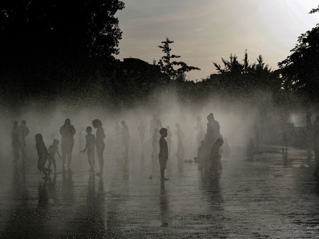 People off in a water fountain as Spain experiences a heatwave, in Madrid, Spain, June 23, 2026. (AFP Photo)