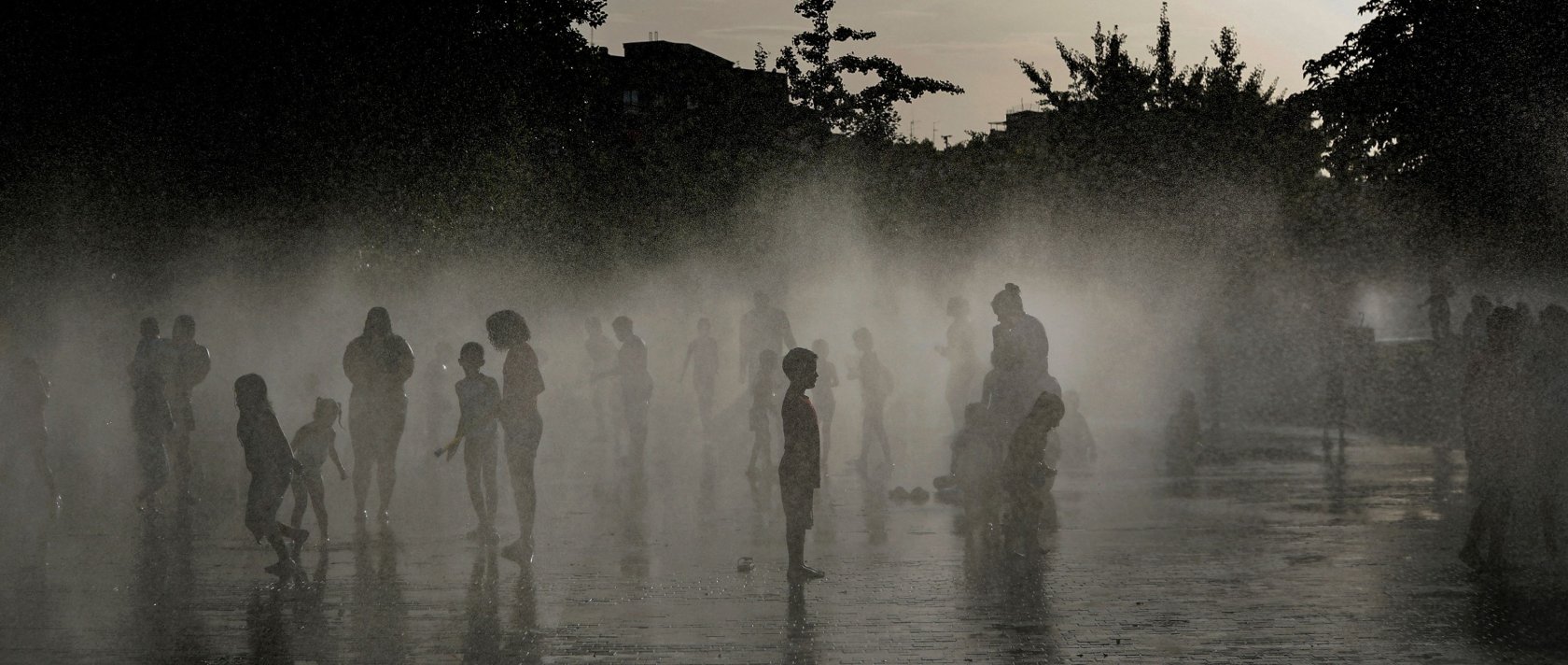 People off in a water fountain as Spain experiences a heatwave, in Madrid, Spain, June 23, 2026. (AFP Photo)