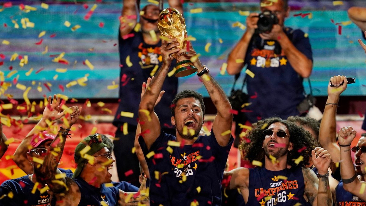 Spain's Rodri celebrates with the World Cup trophy and teammates on stage at Cibeles Square after the victory parade as fans gather to celebrate winning the World Cup, Madrid, Spain, July 20, 2026. (Reuters Photo)