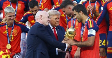 U.S. President Donald Trump (C) and FIFA President Gianni Infantino hand the World Cup trophy to Spain's Rodri ahead of the trophy lift at New York New Jersey Stadium, East Rutherford, U.S., July 19, 2026. (Reuters Photo)