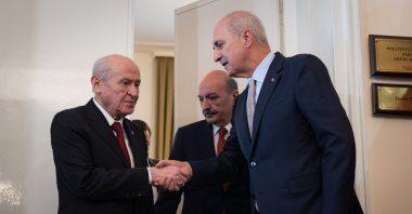 Parliament Speaker Numan Kurtulmuş (R) shakes hands with MHP leader Devlet Bahçeli (L), prior to their meeting, Ankara, Türkiye, July 21, 2026. (AA Photo)