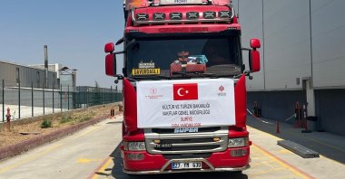 A truck carrying food aid departs for northern Syria, Hatay, Türkiye, July 21, 2026. (IHA Photo) 