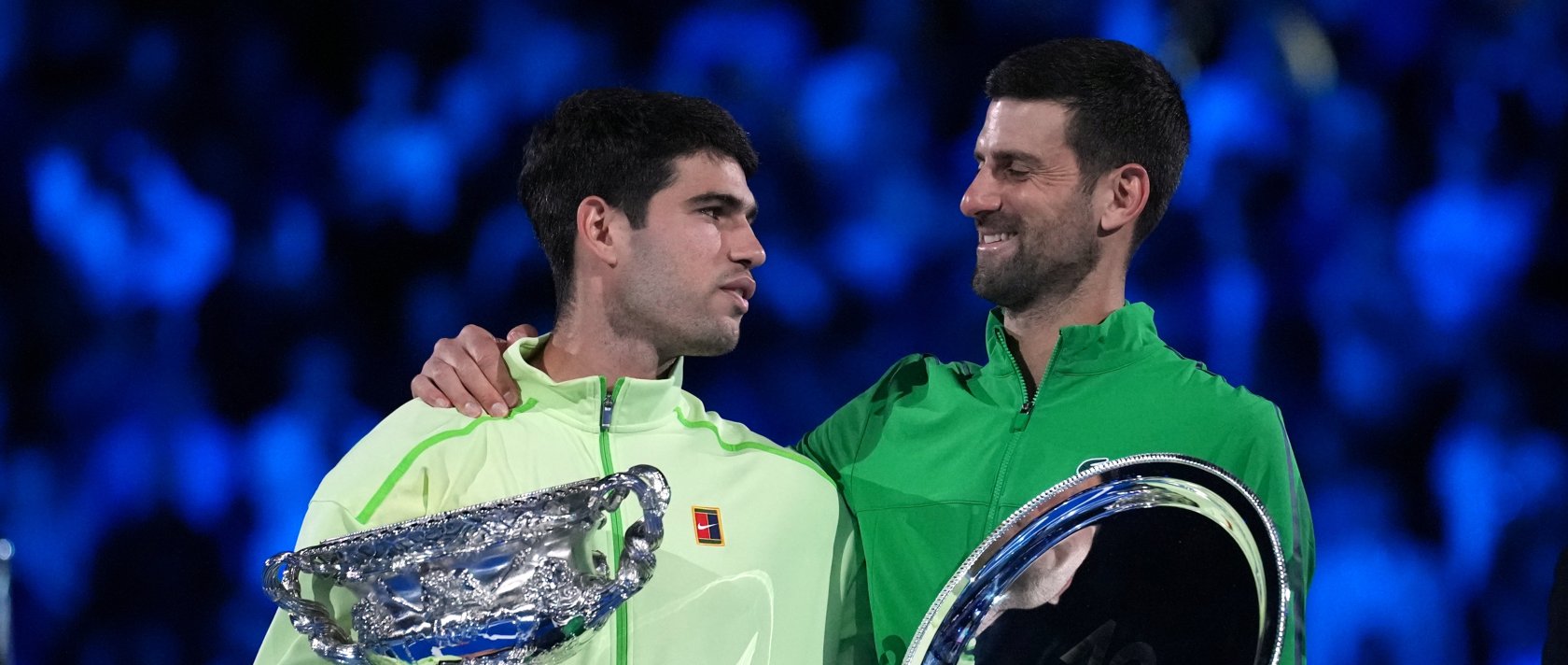 Spain's Carlos Alcaraz (L) holds the Norman Brookes Challenge Cup after defeating Serbia's Novak Djokovic in the men's singles final at the Australian Open tennis championship, Melbourne, Australia, Feb. 1, 2026. (AP Photo)