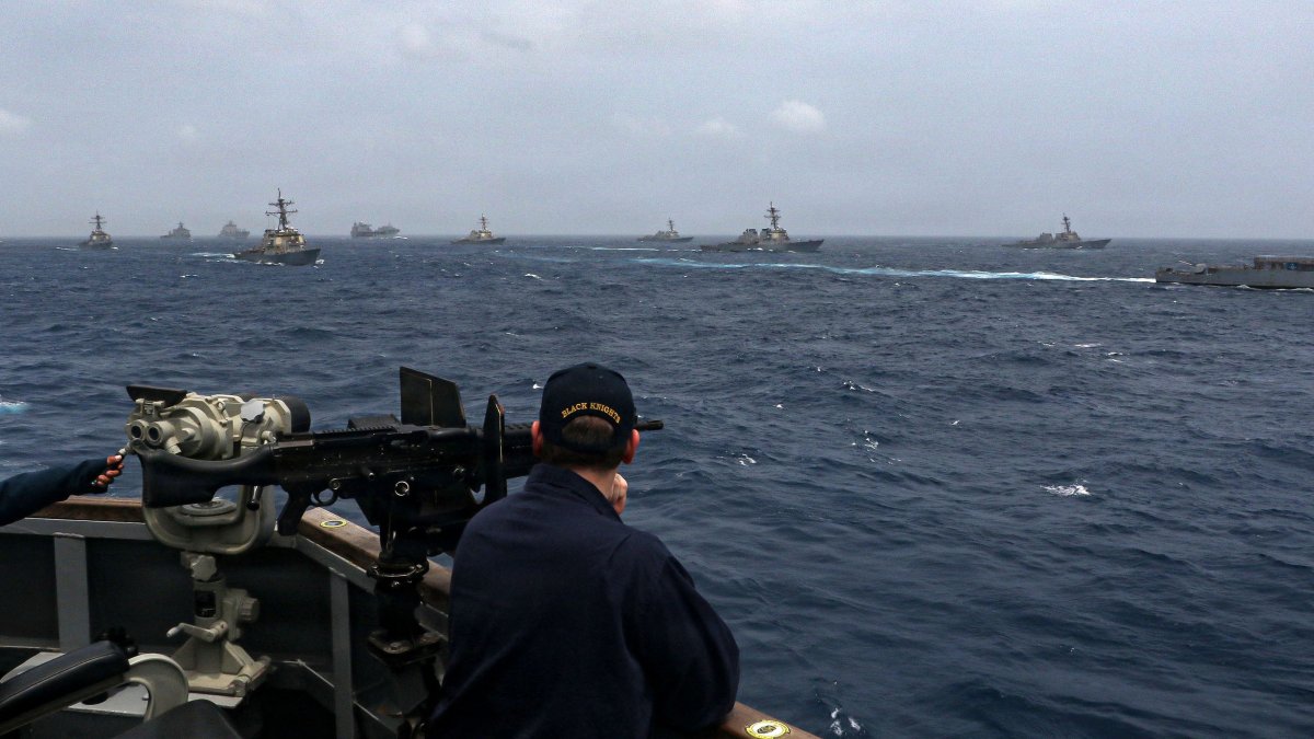 A U.S. Sailor aboard the Arleigh Burke-class guided-missile destroyer USS Frank E. Petersen Jr. observes a photo exercise in the Arabian Sea, July 15, 2025. (AFP Photo)