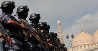 Members of the Houthi security force stand guard as Houthi supporters rally against the Saudi-led coalition in Sanaa, Yemen, July 17, 2026. (Reuters Photo)