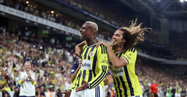 Fenerbahçe's Talisca (L) celebrates with teammate Matteo Guendouzi after scoring during the UEFA Champions League second qualifying round match against Gornik Zabrze at Chobani, Istanbul, Türkiye, July 21, 2026. (AA Photo)