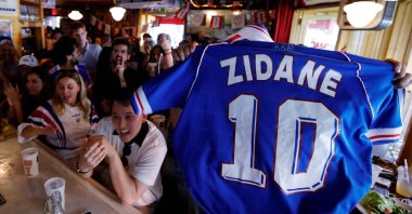 A person holds up a Zidane jersey as France fans watch the 2026 World Cup match between France and Sweden, Brooklyn, New York City, U.S., June 30, 2026. (AFP Photo)