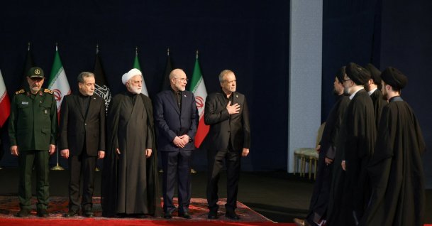Iranian President Masoud Pezeshkian (C) gestures as he greets Hassan Khomeini, grandson of the first Iranian Supreme Leader Ruhollah Khomeini, as he, Iranian military commander Mohsen Rezaee (1st-L), Iranian Foreign Minister Abbas Araqchi (2nd-L), Chief Justice of Iran Gholam-Hossein Mohseni Ejei (3rd-L) and Iran's parliament speaker Mohammad Baqer Qalibaf (4th-L) attend a farewell ceremony for Iran's late Supreme Leader Ali Khamenei, Tehran, Iran, July 3, 2026. (Reuters Photo)