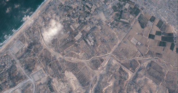 A satellite image from Planet Labs PBC shows a section of an earthen barrier, cutting horizontally across the middle of the image, being built by the Israeli military in the southern Gaza Strip, July 15, 2026. (AP Photo)