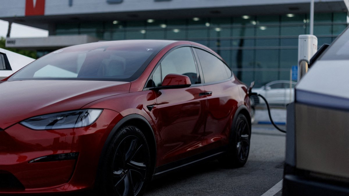 A Tesla model Y is shown charging at a Tesla dealership in Buena Park, California, U.S., Jan. 28, 2026. (Reuters Photo)