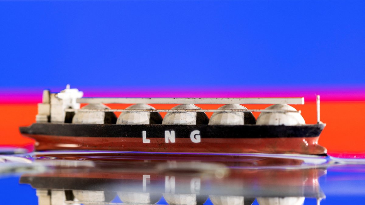 Model of LNG tanker is seen in front of Russia's flag in this illustration taken, May 19, 2022. (Reuters Photo)