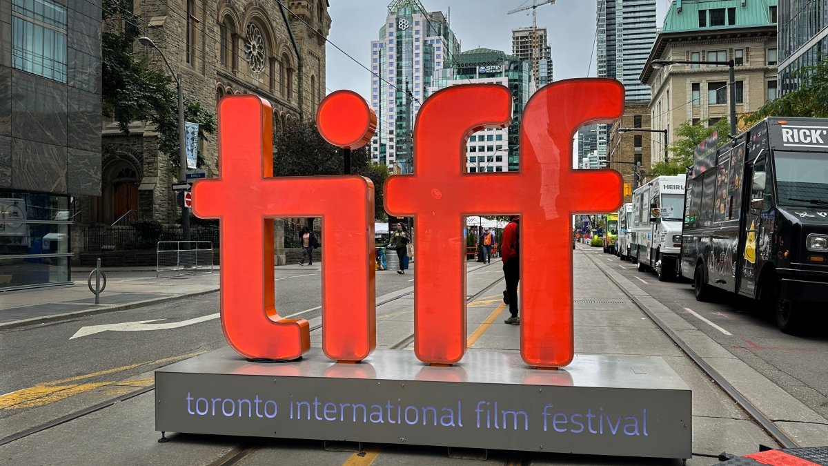 A large backlit “tiff” sign signals the entrance to the pedestrian only street festival in honor of the Toronto International Film Festival, Toronto, Canada, Sept. 9, 2023. (Shutterstock Photo)