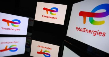 This illustrative photograph shows screens displaying the logo of the French company TotalEnergies, Toulouse, France, March 31, 2026. (AFP Photo)