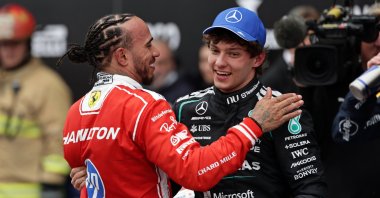 Mercedes' Kimi Antonelli's (R) is congratulated by Ferrari's Lewis Hamilton after winning the Canadian Grand Prix at the Circuit Gilles Villeneuve, Montreal, Canada, May 24, 2026. (AP Photo)