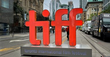 A large backlit “tiff” sign signals the entrance to the pedestrian only street festival in honor of the Toronto International Film Festival, Toronto, Canada, Sept. 9, 2023. (Shutterstock Photo)