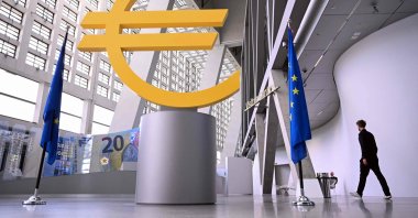 A visitor walks past a giant Euro sign inside the headquarters of the European Central Bank (ECB), Frankfurt am Main, western Germany, June 11, 2026. (AFP Photo)