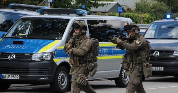 Special police walk toward a suspected hostage-taking situation in a bank in Regensburg, Germany, July 23, 2026. (Reuters Photo)