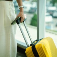 A woman carries her luggage during travel. (Shutterstock Photo)