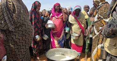 Sudanese women gather for a hot meal in al-Rahmaniyah camp for displaced people, near the city of El-Obeid, Kordofan, Sudan, July 7, 2026. (AFP Photo)