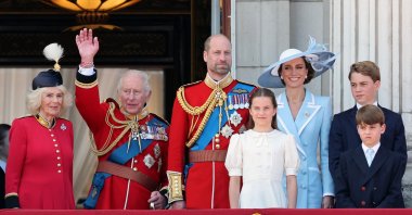 (L-R) Queen Camilla, King Charles III, Prince William, Prince of Wales, Princess Charlotte of Wales, Catherine, Princess of Wales, Prince George of Wales and Prince Louis of Wales watch an RAF flypast, Buckingham Palace during Trooping The Colour, London, U.K., June 13, 2026. (Getty Images Photo)