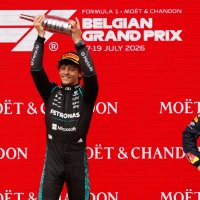 Mercedes' Andrea Kimi Antonelli (L) celebrates on the podium with third-place Red Bull driver Max Verstappen after winning the Formula One Grand Prix at the Spa-Francorchamps racetrack, Spa, Belgium, July 19, 2026. (AP Photo)