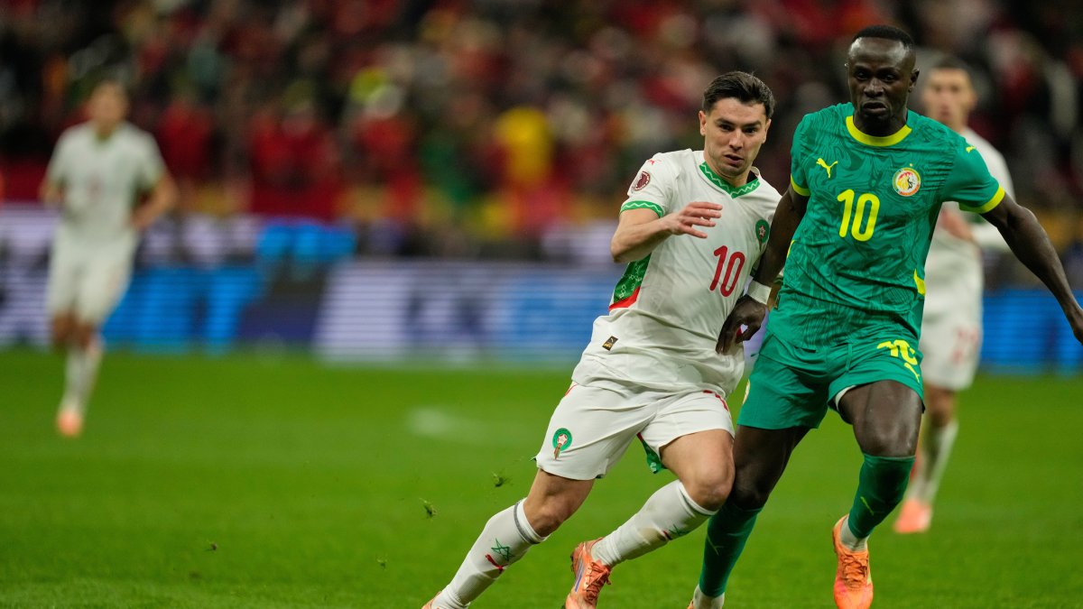 Morocco's Brahim Diaz (L) and Senegal's Sadio Mane fight for the ball during the Africa Cup of Nations final match, Rabat, Morocco, Jan. 18, 2026. (AP Photo)