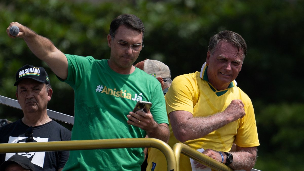 Brazil's former president Jair Bolsonaro (R) and his son Senator Flavio Bolsonaro take part in a rally in Copacabana, Rio de Janeiro, Brazil, March 16, 2025. (AFP Photo)