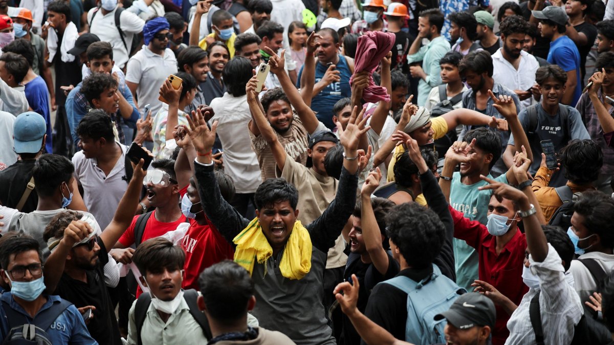 Supporters of India's Cockroach Janta Party (CJP) celebrate after India’s Education Minister Dharmendra Pradhan resigned following days of protests demanding his resignation over National Eligibility cum Entrance Test (NEET) examination paper leaks, at Jantar Mantar, New Delhi, India, July 25, 2026. (Reuters Photo)
