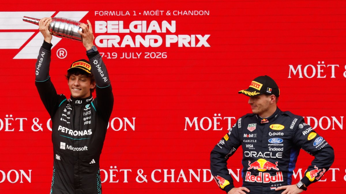 Mercedes' Andrea Kimi Antonelli (L) celebrates on the podium with third-place Red Bull driver Max Verstappen after winning the Formula One Grand Prix at the Spa-Francorchamps racetrack, Spa, Belgium, July 19, 2026. (AP Photo)