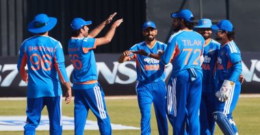 Indian players celebrate the wicket of Brian Bennet during the second Twenty20 international cricket match between Zimbabwe and India at Harare Sports Club, Harare, Zimbabwe, July 25, 2026. (AFP Photo)