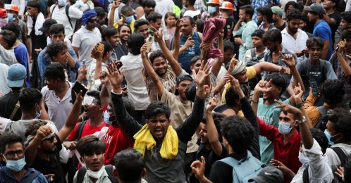 Supporters of India's Cockroach Janta Party (CJP) celebrate after India’s Education Minister Dharmendra Pradhan resigned following days of protests demanding his resignation over National Eligibility cum Entrance Test (NEET) examination paper leaks, at Jantar Mantar, New Delhi, India, July 25, 2026. (Reuters Photo)