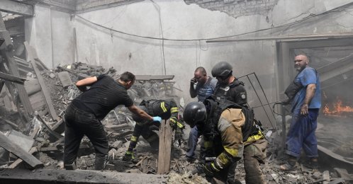 Rescuers and employers work at a site of the drinking water delivery company hit by a Russian air strike, amid Russia's attack on Ukraine, Zaporizhzhia, Ukraine, July 25, 2026. (Reuters Photo)