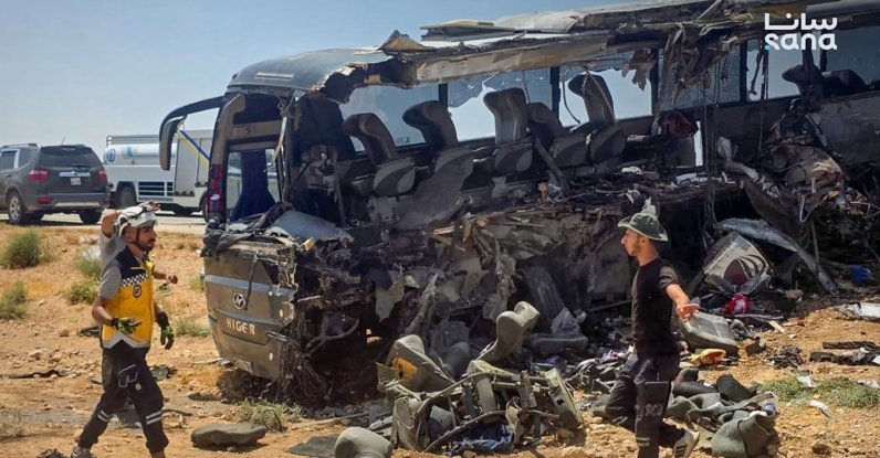 This handout picture taken and released by the official Syrian Arab News Agency (SANA)  shows people and first responders inspecting the damage at the scene of the collision of two passenger buses on the Damascus-Deir Ezzor road between the Sukhna and Palmyra areas, Syria, July 25, 2026. (AFP Photo)