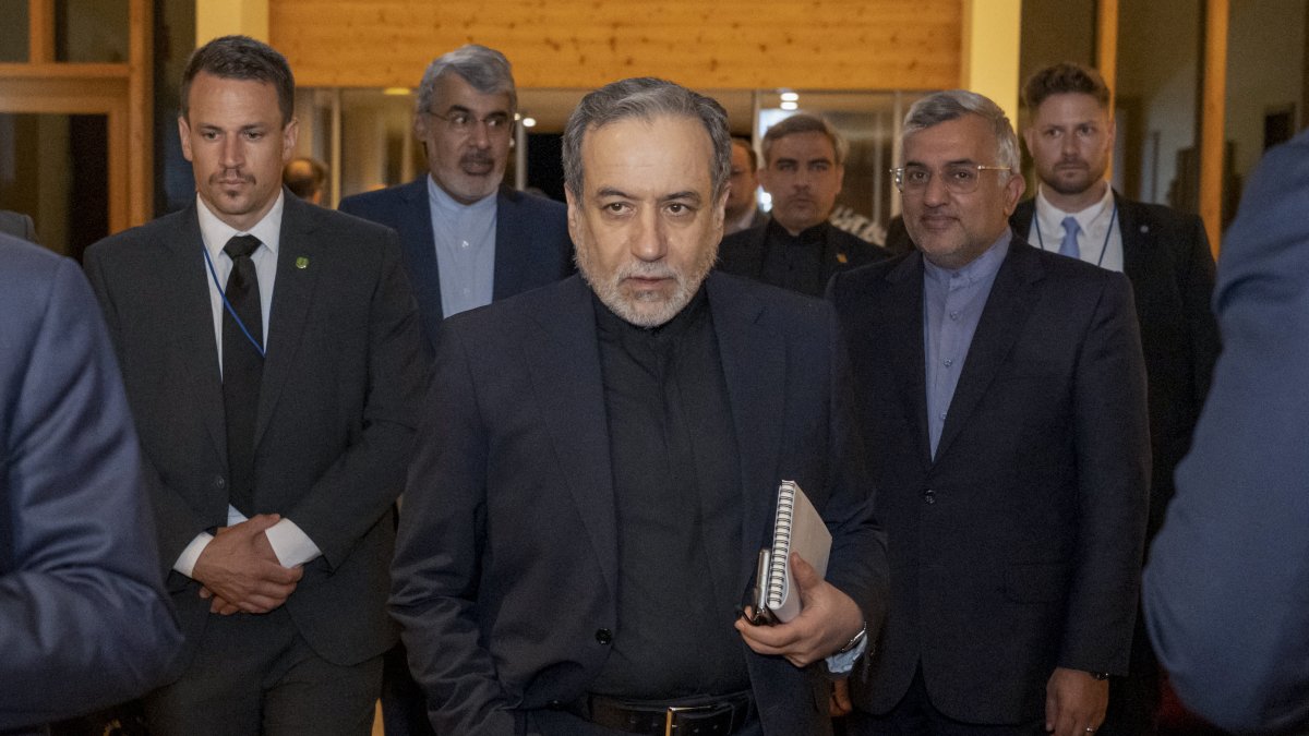 Iran's Minister of Foreign Affairs Seyyed Abbas Araghchi (C) arrives at the Burgenstock resort in Obbuergen, near Lucerne on June 21, 2026. (AFP File Photo)