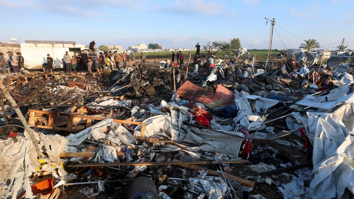 Palestinians inspect the site of an Israeli strike on a tent camp sheltering displaced people, who were warned to evacuate before the attack, in Khan Younis, in the southern Gaza Strip, June 30, 2026. (Reuters Photo)