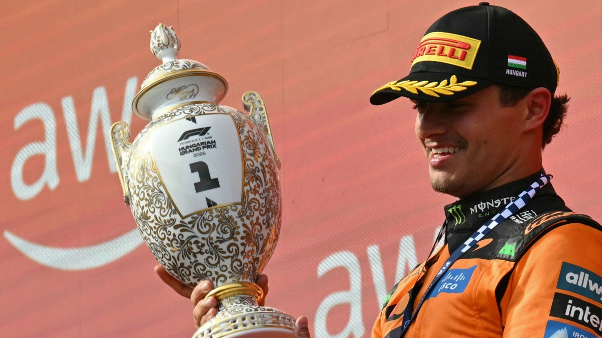 McLaren's British driver Lando Norris celebrates with the trophy after winning the Formula 1 Hungarian Grand Prix at the Hungaroring racetrack in Mogyorod near Budapest, Hungary, July 26, 2026. (AFP Photo)