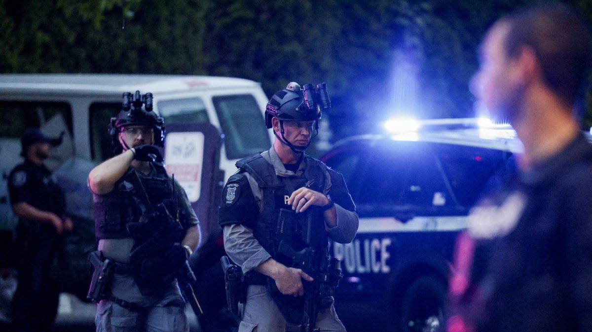 Police officers guard an area after a shooting incident with "multiple" victims at Seattle Center, in Seattle, Washington, U.S., July 26, 2026. (Reuters Photo)
