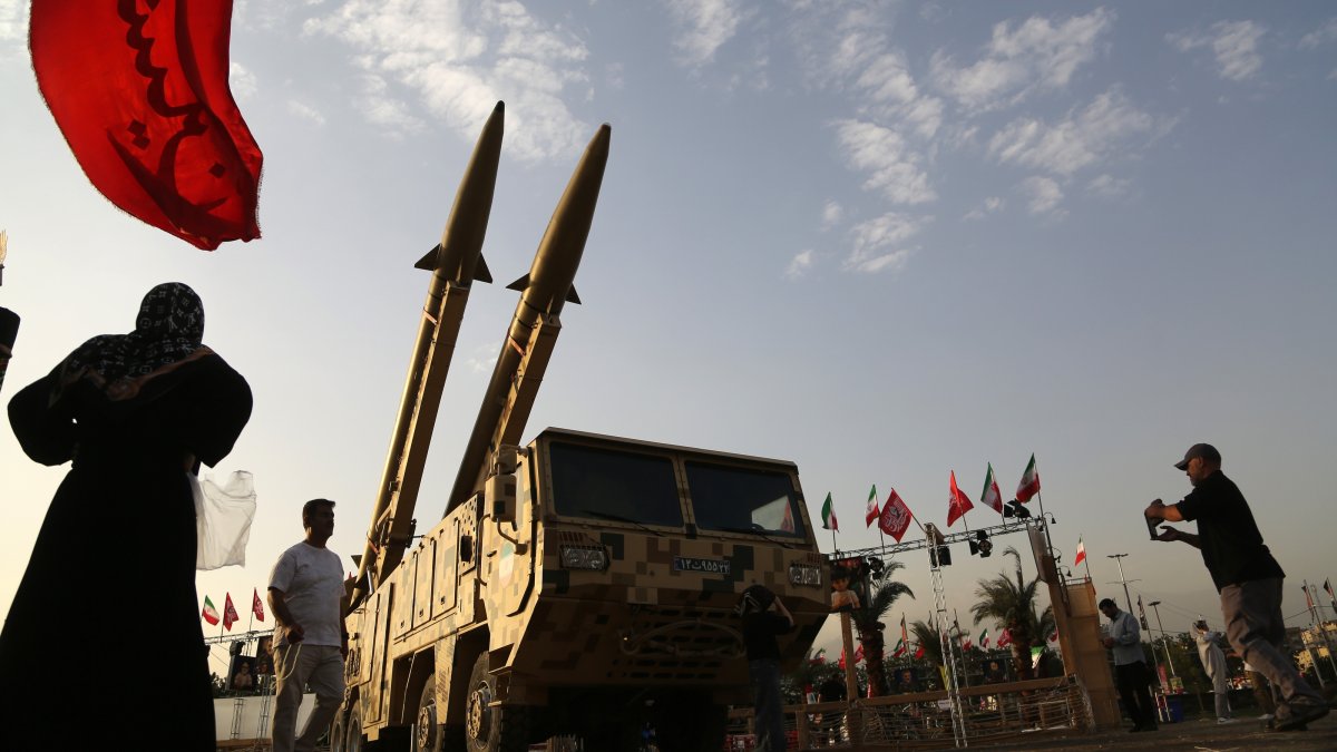 People walk around Iranian missiles, Zolfaghar, on display at Azadi Square in Tehran, Iran, July 24, 2026. (AA Photo)