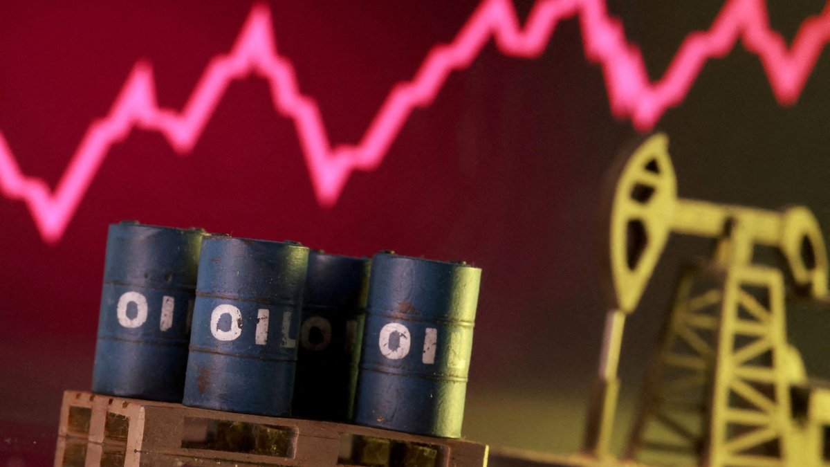 A 3D-printed oil pump jack and barrels in front of a rising stock graph appear in this illustration, taken March 2, 2026. (Reuters Photo)