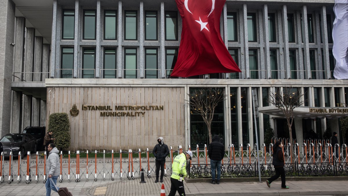 People walk in front of the Istanbul Metropolitan Municipality (IBB) headquarters, Istanbul, Türkiye, March 19, 2025. (Getty Images Photo)
