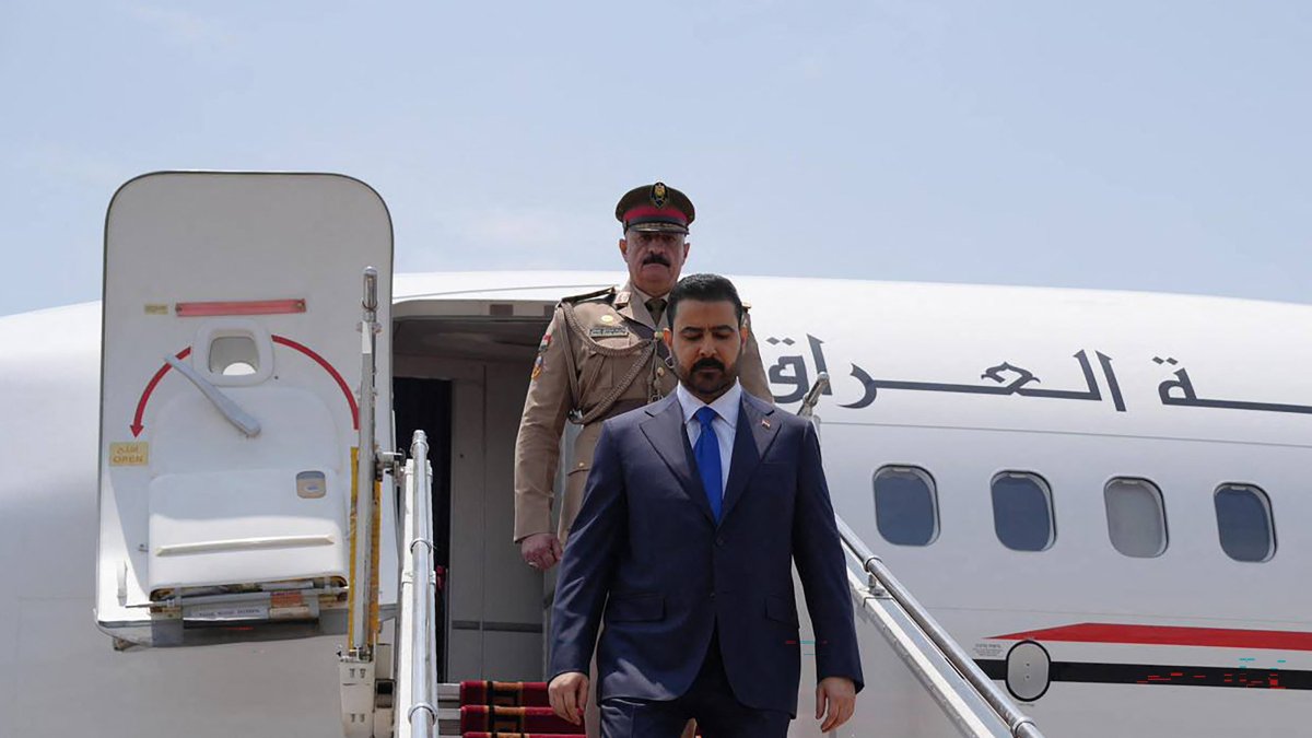 Iraq's Prime Minister Ali al-Zaidi (R) disembarking from his plane upon landing, Tehran, Iran, July 23, 2026. (AFP Photo)