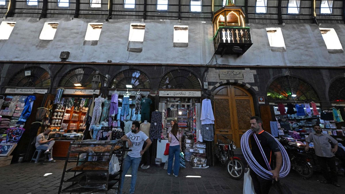 Shopkeepers wait for customers in an old market near the Umayyad Mosque, Damascus, Syria, July 9, 2026. (AFP Photo)