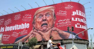Motorists drive past a large billboard pledging revenge against U.S. President Donald Trump along Jomhouri Street in central Tehran, July 27, 2026. (AFP Photo)