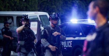Police officers guard an area after a shooting incident with "multiple" victims at Seattle Center, in Seattle, Washington, U.S., July 26, 2026. (Reuters Photo)