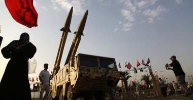 People walk around Iranian missiles, Zolfaghar, on display at Azadi Square in Tehran, Iran, July 24, 2026. (AA Photo)