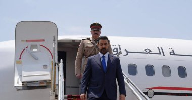 Iraq's Prime Minister Ali al-Zaidi (R) disembarking from his plane upon landing, Tehran, Iran, July 23, 2026. (AFP Photo)