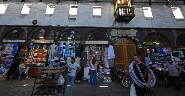 Shopkeepers wait for customers in an old market near the Umayyad Mosque, Damascus, Syria, July 9, 2026. (AFP Photo)